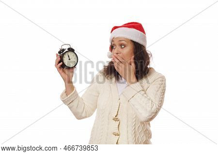 Surprised Woman Wearing Santa Hat, Expresses Astonishment, Surprise, Bewilderment And Stupefaction, 