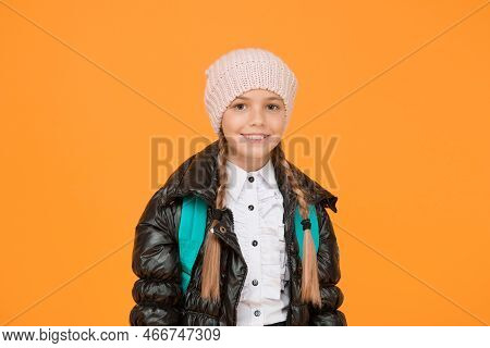 Future Focused Learning. Happy Little Schoolgirl Smiling On Yellow Background. Small Child In Autumn