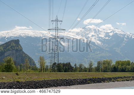 Balzers, Liechtenstein, April 28, 2022 High Voltage Electric Pole In An Alpine Scenery