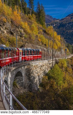 Cadera, Switzerland - October 28,2022: Bernina Express Of Rhaetian Railway Line Going Up To The Bern