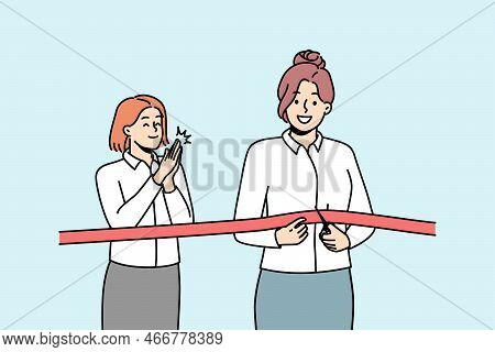 Happy Businesswoman Cuts Red Ribbon With Scissors Accompanied By Applause. Opening Ceremony Of Resta