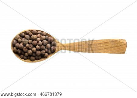 Allspice For Adding To Food. Allspice In Wooden Spoon Isolated On White. Allspice Of Delicious Meal.