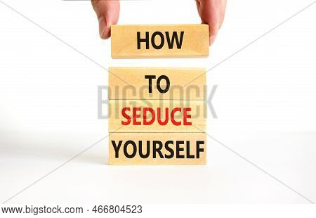 How To Seduce Yourself Symbol. Concept Word How To Seduce Yourself On Wooden Blocks. Businessman Han