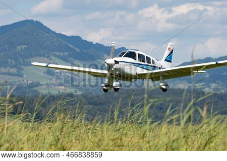 Wangen-lachen, Switzerland, July 31, 2022 Piper Pa28-181 Archer Ii Is Landing On A Small Airfield