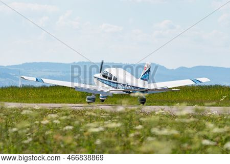 Wangen-lachen, Switzerland, July 31, 2022 Piper Pa28-181 Archer Ii Is Landing On A Small Airfield