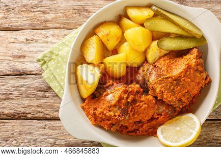 Macanese African Chicken Galinha A Africana Close Up On The Pot On The Table. Horizontal Top View Fr