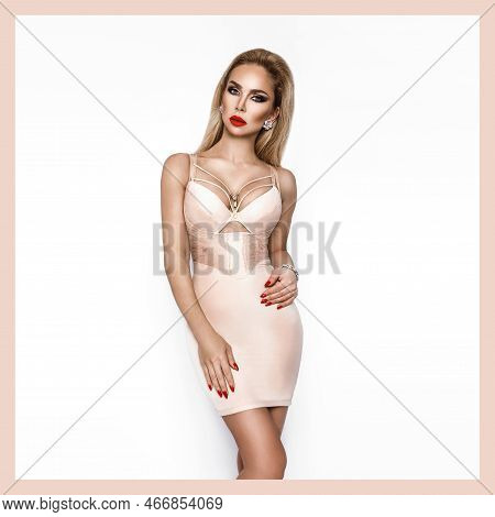 Shapewear, Underwear Fashion. Beautiful Sexy Blonde Woman In Elegant Underwear On A White Background