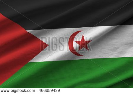 Western Sahara Flag With Big Folds Waving Close Up Under The Studio Light Indoors. The Official Symb