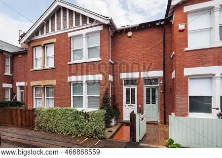 Marlowe Road, Cambridge, England - Nov 1 2018: Traditional Bay Fronted Red Brick Mews Terrace House 