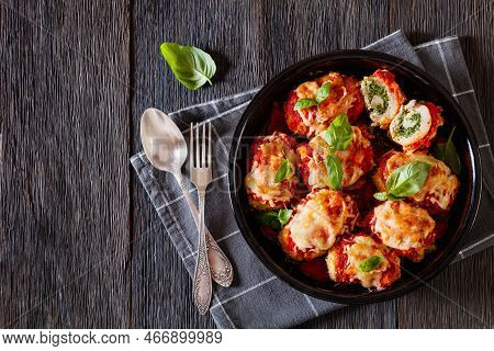 Chicken Rollatini With Spinach Ricotta Filling In Marinara Sauce Topped With Mozzarella Cheese And F