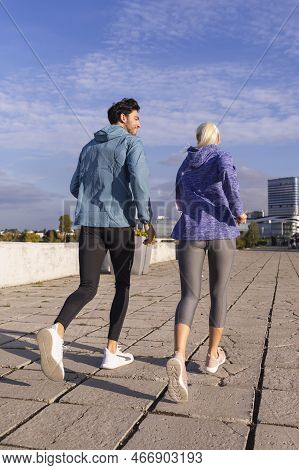 Jogging Concepts. City Running Couple Having Jogging Outside As Runners During Training Outdoor Work