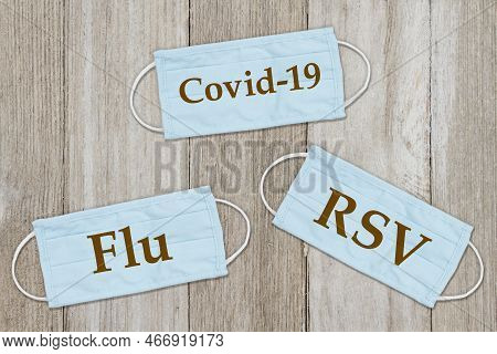 Rsv, Covid-19 And Flu Message On Face Masks On Weathered Wood