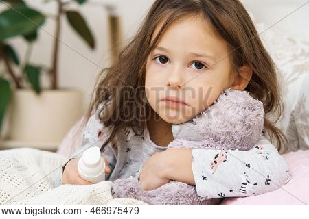 Sad Depressed Worried, Sunless Little Brunette Girl Embracing Bear Toy, Healing With Nose Spray, Sit