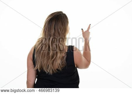 Overweight Rear View Woman From Behind Points Finger To Side Of Empty Panel Mockup Pointing To Side 
