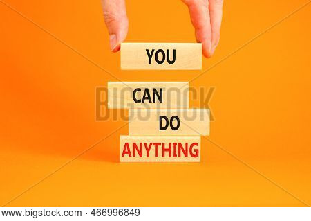 You Can Do Anything Symbol. Concept Word You Can Do Anything On Wooden Blocks. Businessman Hand. Bea