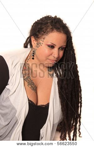 Tattooed Woman  With Piercings And Dreadlocks