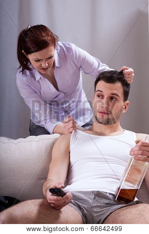 Husband Watching Tv And Drinking Alcohol