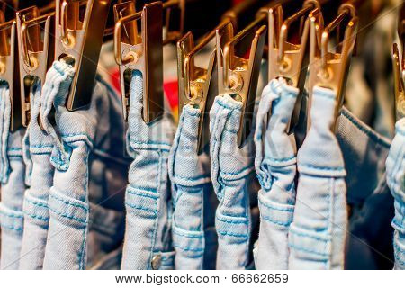 Jeans Iron Clothespins Hanging In The Closet