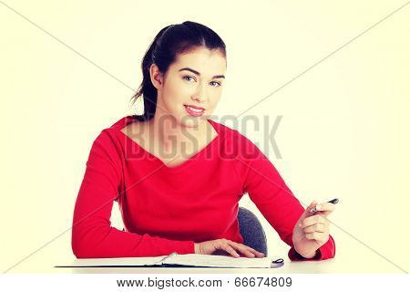 Adult student woman learnig at the desk.