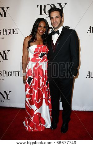 NEW YORK-JUNE 8: Actress Audra McDonald (L) and husband Will Swenson attend American Theatre Wing's 68th Annual Tony Awards at Radio City Music Hall on June 8, 2014 in New York City.