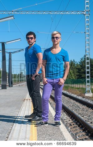 Two young men standing on the platform