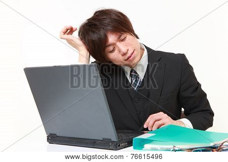 businessman suffers from headache