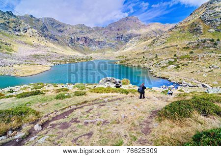 People Hiking To Estany Primer In Tristaina, Andorra
