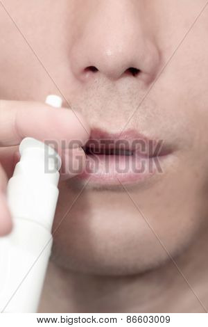 Man With Nose Medicine In His Hand