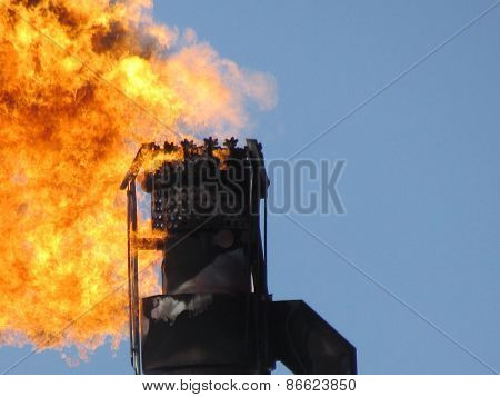 Torch system on an oil field