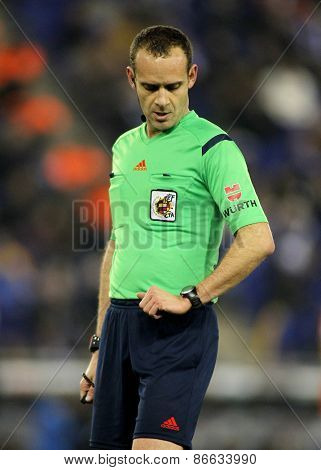 BARCELONA - 8, FEB: Referee Mario Melero Lopez check the time during a Spanish League match between RCD Espanyol vs Valencia CF at the Estadi Cornella on February 8, 2015 in Barcelona, Spain