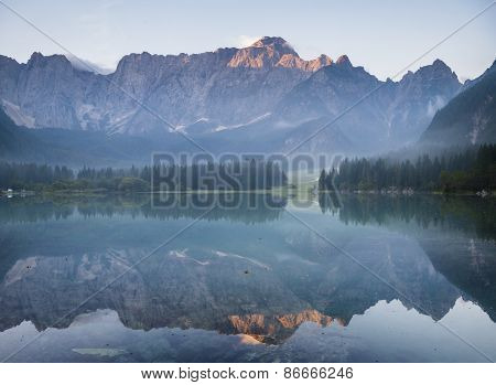 Alpine lake,Sunrise over the alpine lake Laghi di Fusine
