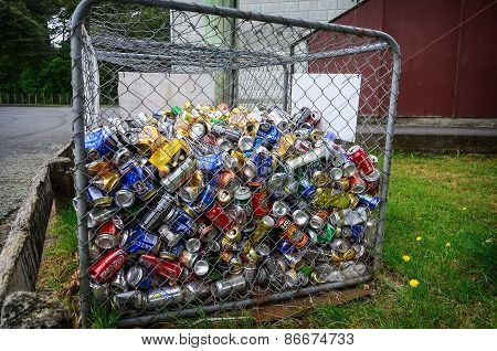 Different Cans For Recycling Into A Container