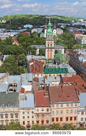 Assumption Orthodox Church With Korniakt Tower And Lviv Cityscape In Lviv, Ukraine