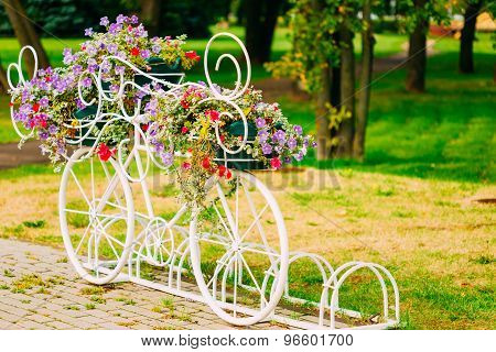 White Decorative Bicycle Parking In Garden