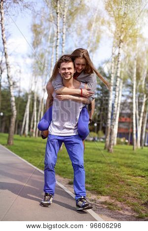 Cheerful couple having fun in the park