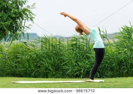 Half Moon Yoga Pose In The Nature