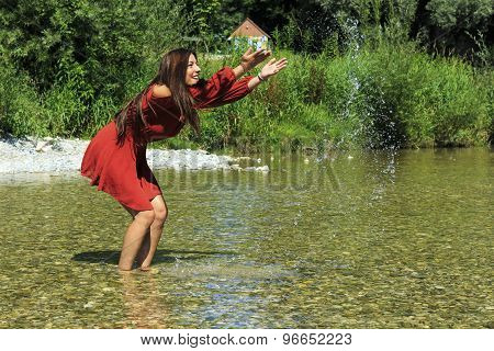 Girl splashing with water
