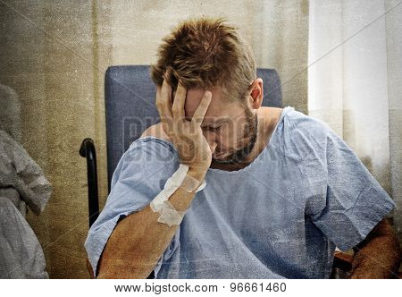 Young Injured Man In Hospital Room Sitting Alone In Pain Worried For His Health Condition