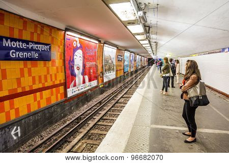 Tourists And Locals On A Subway Train In Paris