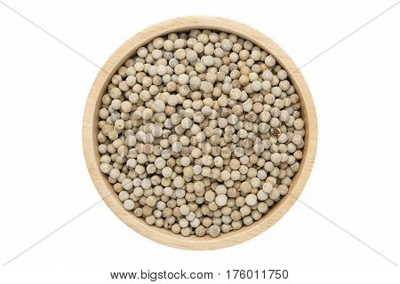 White peppercorns in wooden bowl isolated top view on white with clipping path
