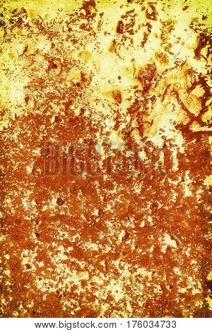 An old rusty wall with stains. Yellow and red.