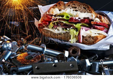 Sandwich with pork lettuce and mayonnaise in a workshop scenery