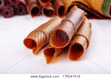 Apple fruit leather rolls. Fruit candy - pastille. Healthy snack.