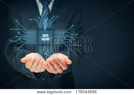 Data mining (data-minig) concept. Abstract symbol of a chip with text data mining connected with data represented by points.