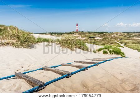Beautiful dune landscape with traditional lighthouse on the island of Amrum at North Sea Schleswig-Holstein Germany
