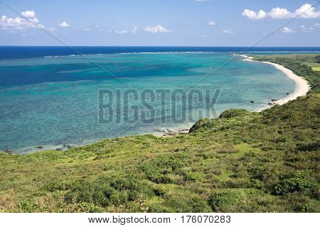 Outlooking turquoise green sea and bush in Ishigaki island