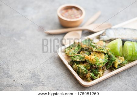 Thai local popular food as spicy shrimp paste dip (Nam Prik Kapi in Thai) served with fried mackerels sliced cucumber and fried acacia pennata omelet