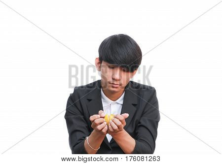 handsome man eating a fresh orange on white background