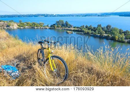 Rural View tih River and Grass and Cycle standing Outdoors