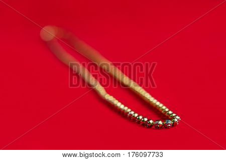 Gold Necklace 750K Gold Grade With Italy Design On Red Flannel Cloth Background